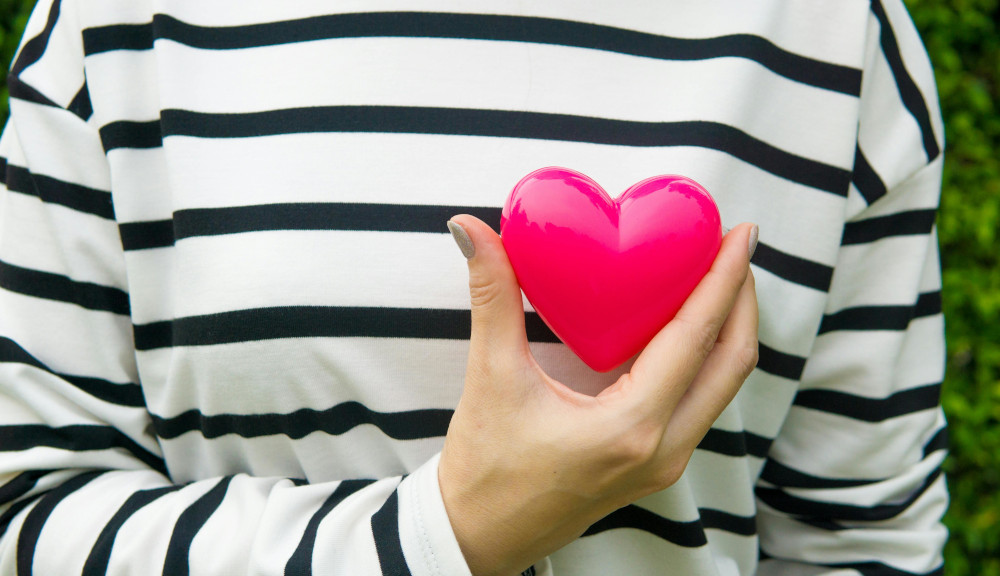 Person holding a Heart