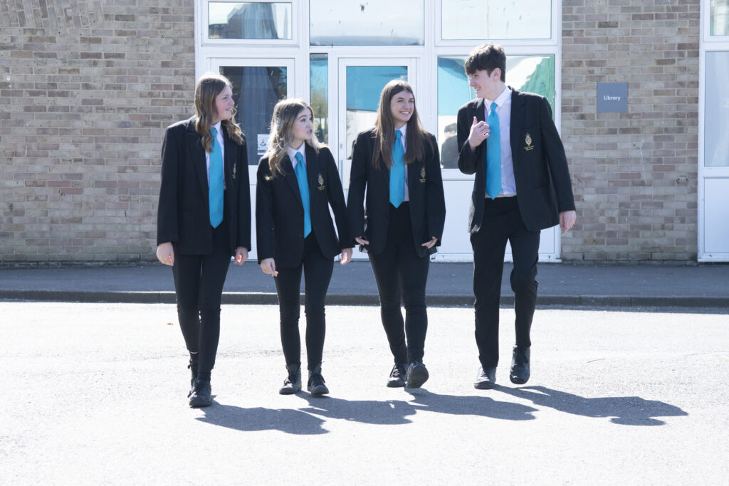 4 Pupils standing outside Library