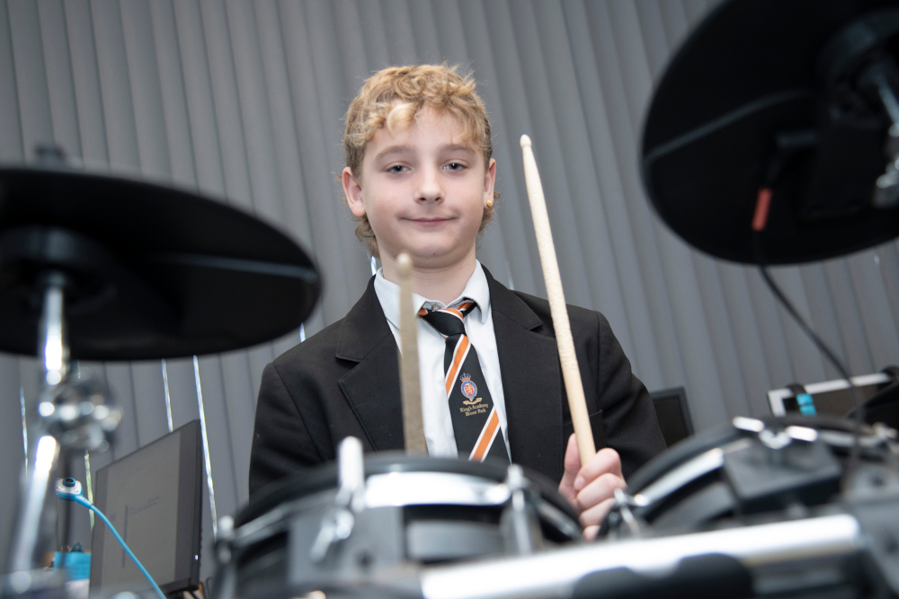 Student Playing the Drums Student Playing the Drums
