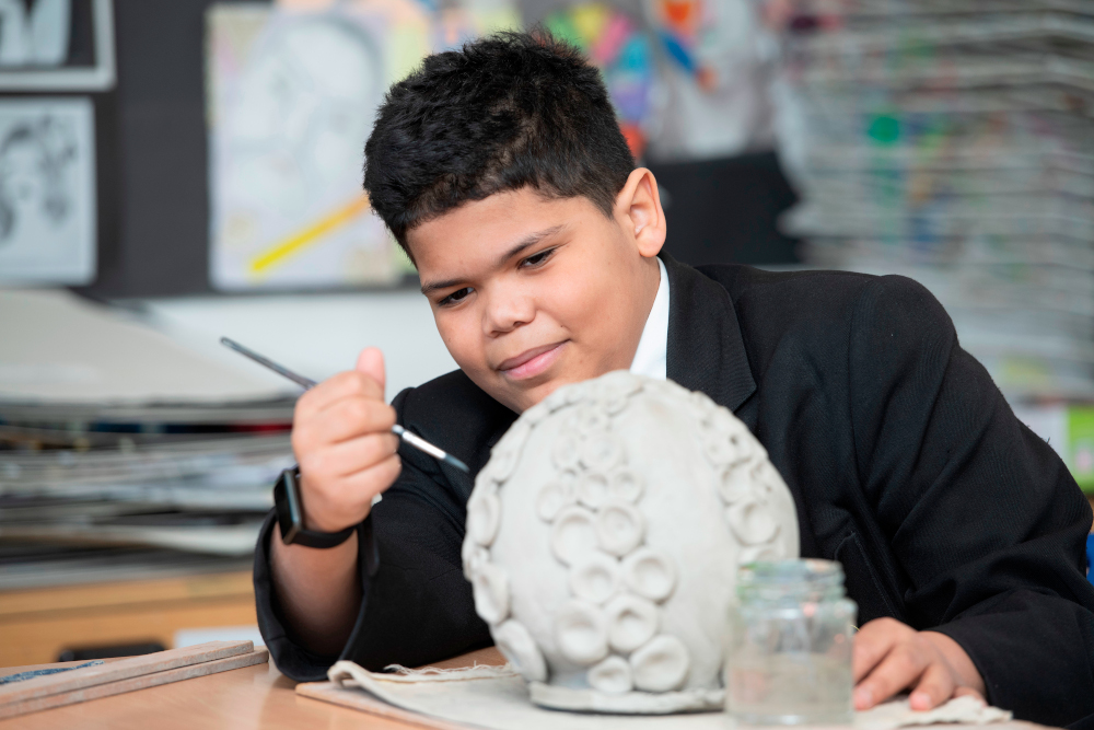 Student-Sculpting-Clay Student Sculpting Clay