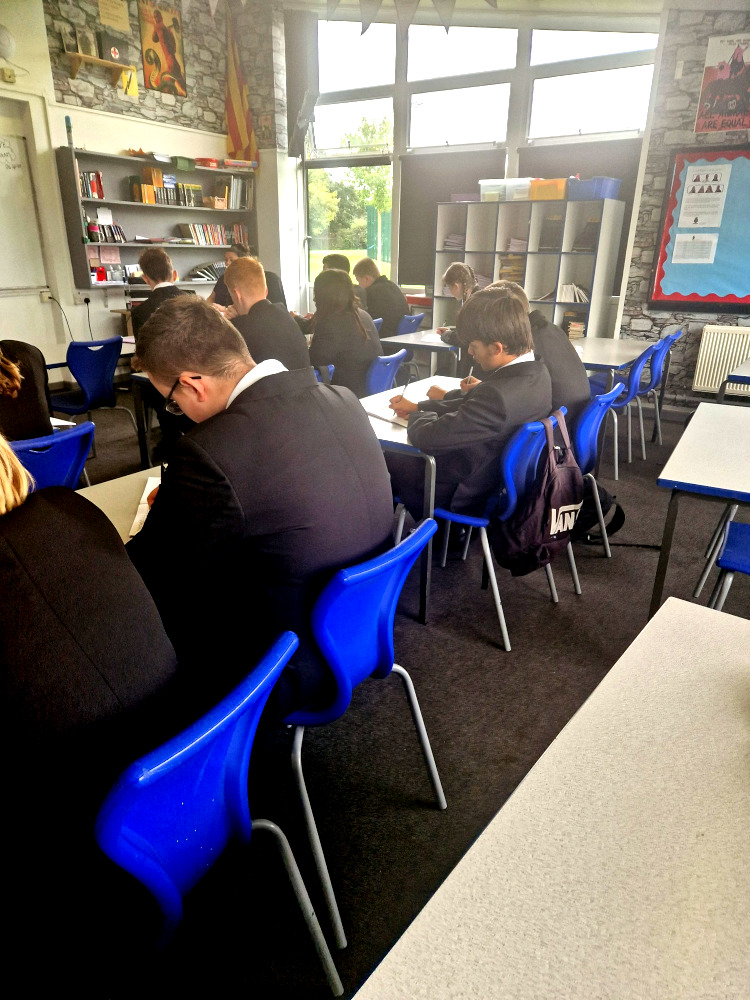 Students-Writing-in-their-Exercise-Books Students Writing in their Exercise Books