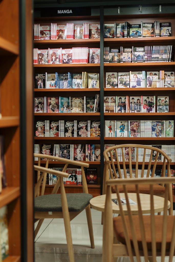 Peaceful manga bookstore section with wooden chairs and manga-filled shelves.